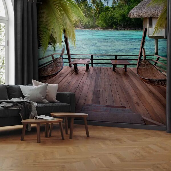 Carta da parati Motivo tropicale - acqua turchese con palme e casette di legno