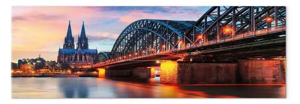 Quadro moderno Colonia, Germania - ponte illuminato al tramonto sulla città