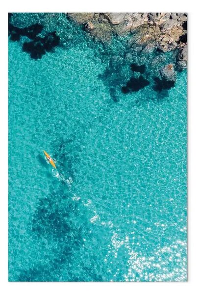 Quadro su tela Paesaggio marino con acqua trasparente e una canoa gialla