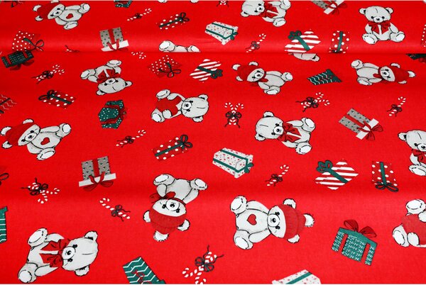 Tessuto decorativo natalizio in cotone con orsacchiotti, regali e caramelle su sfondo rosso