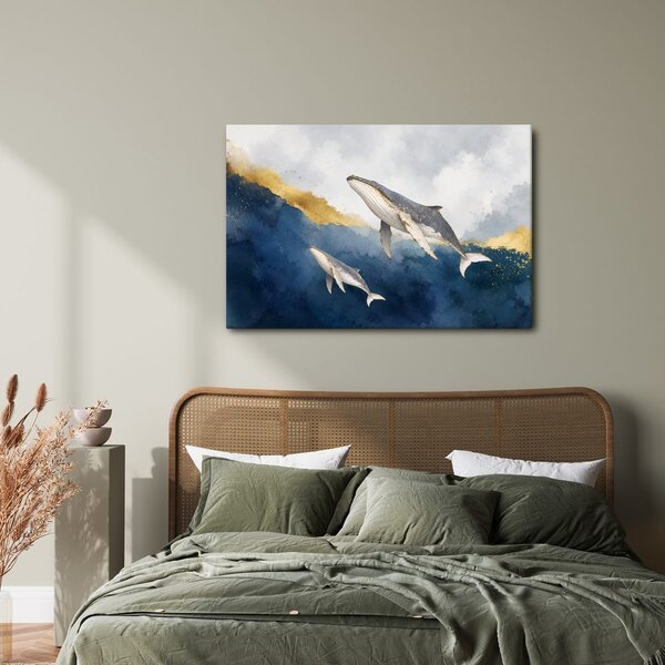 Quadro su tela – Balene tra onde dorate