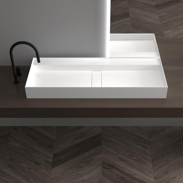 Lavabo da parete in mineralguss, modello TWG211, colore bianco opaco, forma rettangolare. Disponibile in diverse larghezze (80/100/120 cm). Dotato di miscelatore a due maniglie, facile da pulire
