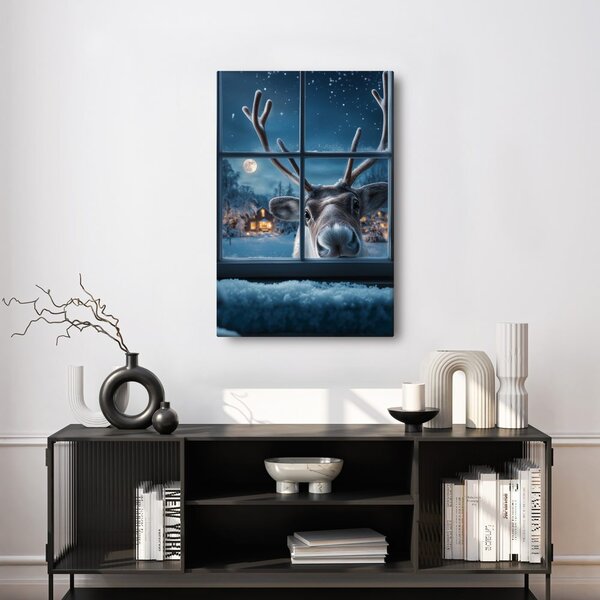 Quadro su tela Natalizio – Renna carina dietro finestra innevata