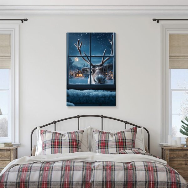 Quadro su tela Natalizio – Renna carina dietro finestra innevata