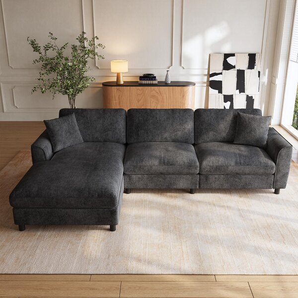 Divano angolare 256x137x79 cm, color grigio, a 3 posti, con superficie trasformabile in letto e rivestimento in chenille. Cuscini removibili, ideale per il soggiorno