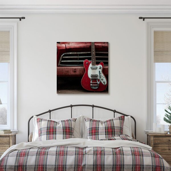 Quadro su tela – Chitarra rossa davanti all'auto