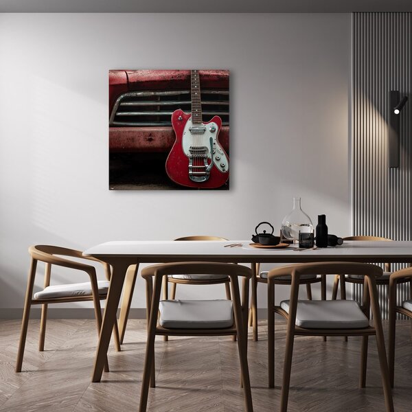 Quadro su tela – Chitarra rossa davanti all'auto