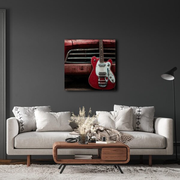 Quadro su tela – Chitarra rossa davanti all'auto