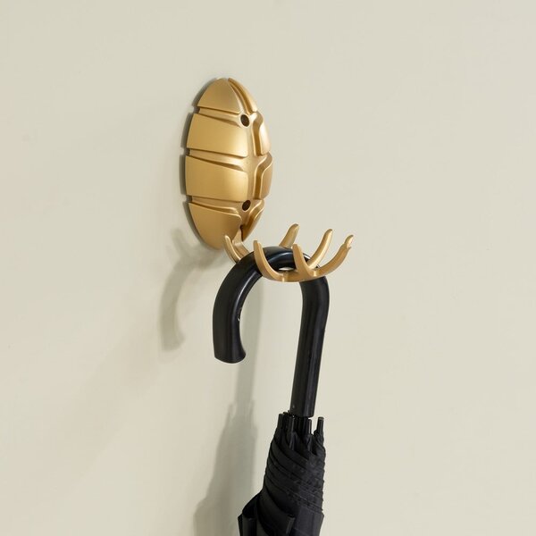 Gancio da parete dorato in plastica Bug – Spinder Design