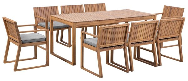 Set da pranzo da giardino 9 pezzi in legno di acacia chiaro 8 sedie con cuscini di seduta grigio chiaro Beliani
