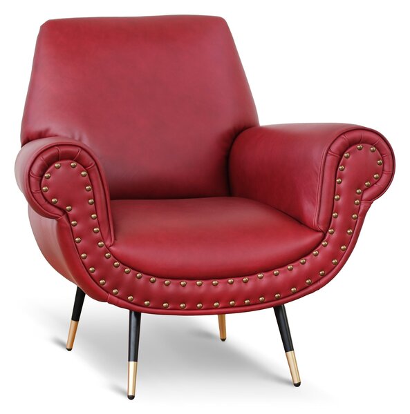 Poltrona design vintage Vico pelle fiore pull up rosso ciliegia con borchie anticate e gambe nere e ottone