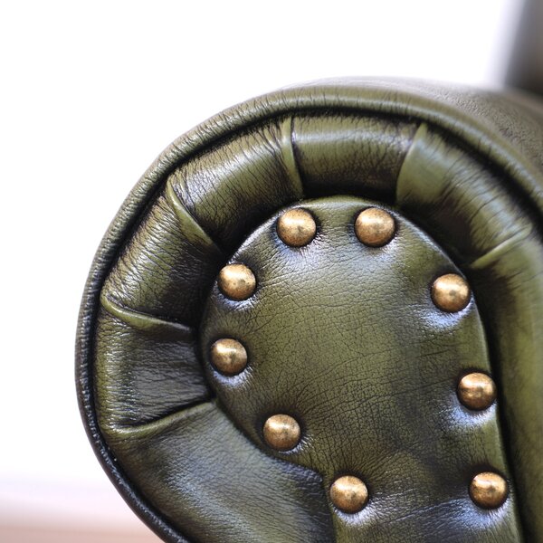 Poltrona design vintage Vico pelle fiore verde stile old America rifinita a mano con borchie anticate e gambe nere e ottone