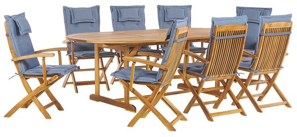 Set da giardino di un tavolo e 8 sedie con cuscini azzurri Beliani