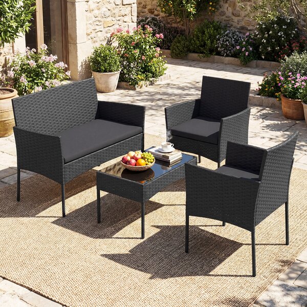 Costway Salotto da giardino in rattan 4 pz con divano poltrone e tavolino vetro, Set esterno con cuscini per balcone terrazzo e patio Nero