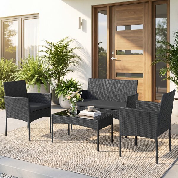Costway Salotto da giardino in rattan 4 pz con divano poltrone e tavolino vetro, Set esterno con cuscini per balcone terrazzo e patio Nero