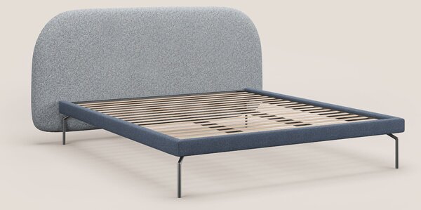 Soleil letto imbottito di design con piedi alti in metallo in bouclet