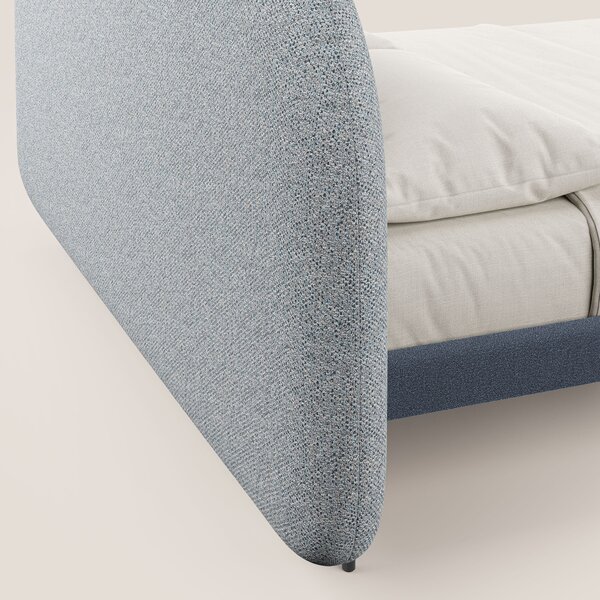 Soleil letto imbottito di design con piedi alti in metallo in bouclet