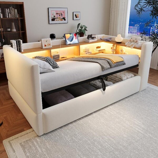 Divano letto 90x190 cm color beige, con vano contenitore a sollevamento idraulico, illuminazione a LED, presa di corrente e ripiani portaoggetti, rivestito in flanella