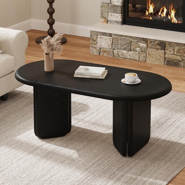Tavolino ovale nero, dimensioni 99x50x40 cm, realizzato in MDF con finitura effetto legno, con una capacità di carico fino a 40 kg, dotato di gambe arrotondate, ideale per il soggiorno
