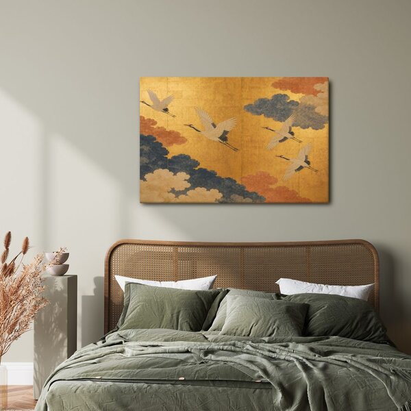 Quadro su tela – Gru tra nuvole dorate