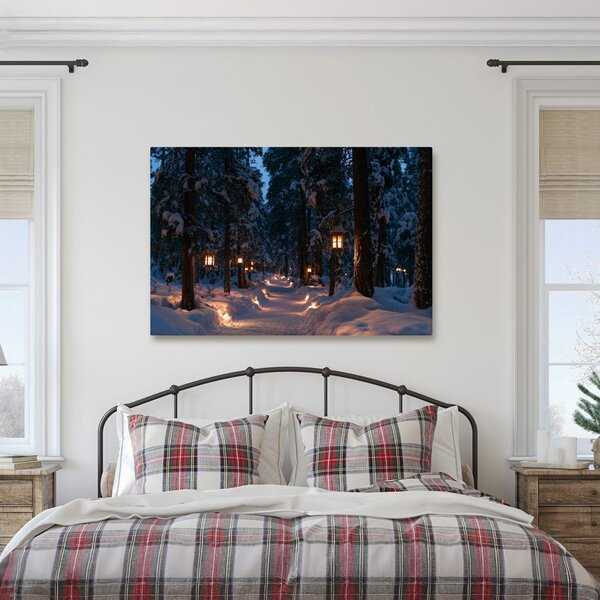 Quadro su tela – Sentiero nel bosco innevato con luci