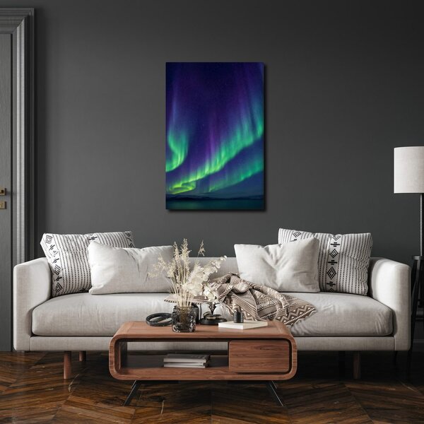 Quadro su tela – Bagliore verde e viola nel cielo notturno