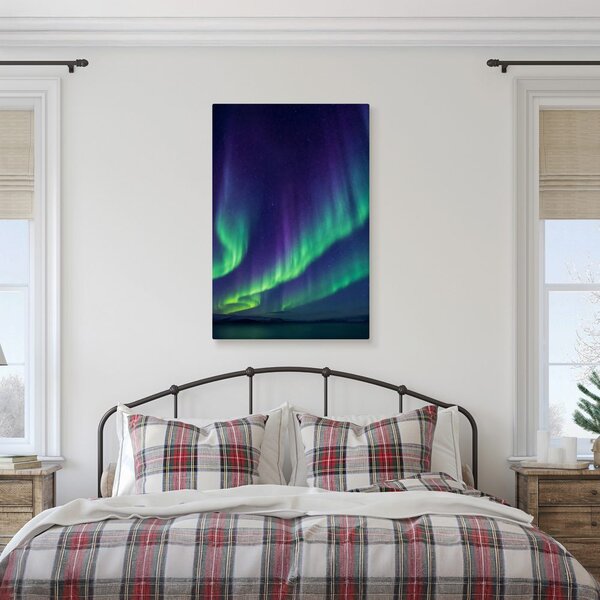 Quadro su tela – Bagliore verde e viola nel cielo notturno