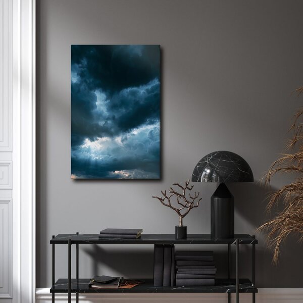Quadro su tela – Nuvole scure con raggi di luce