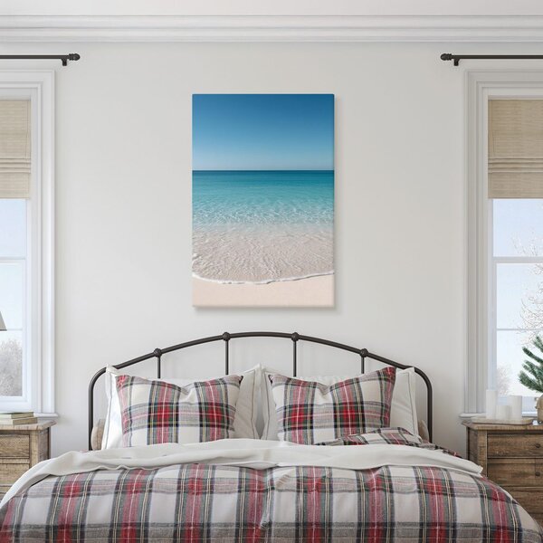 Quadro su tela – Onde delicate sulla riva chiara