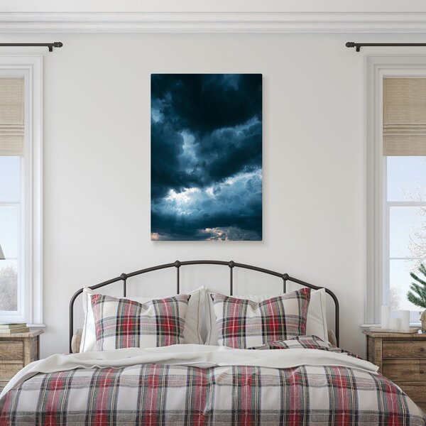 Quadro su tela – Nuvole scure con raggi di luce