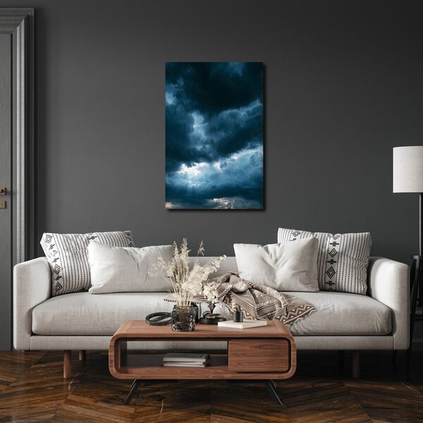 Quadro su tela – Nuvole scure con raggi di luce