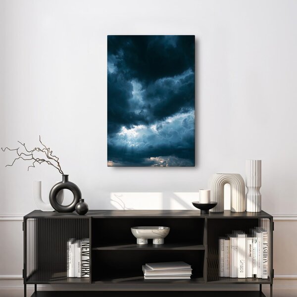 Quadro su tela – Nuvole scure con raggi di luce