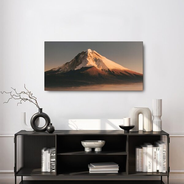 Quadro su tela – Montagna innevata nella luce dorata