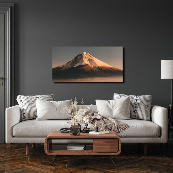 Quadro su tela – Montagna innevata nella luce dorata