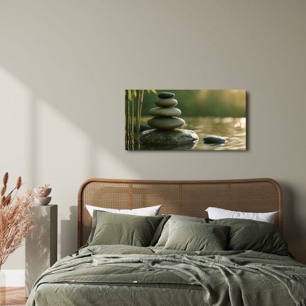 Quadro su tela – Equilibrio di pietre accanto al bambù