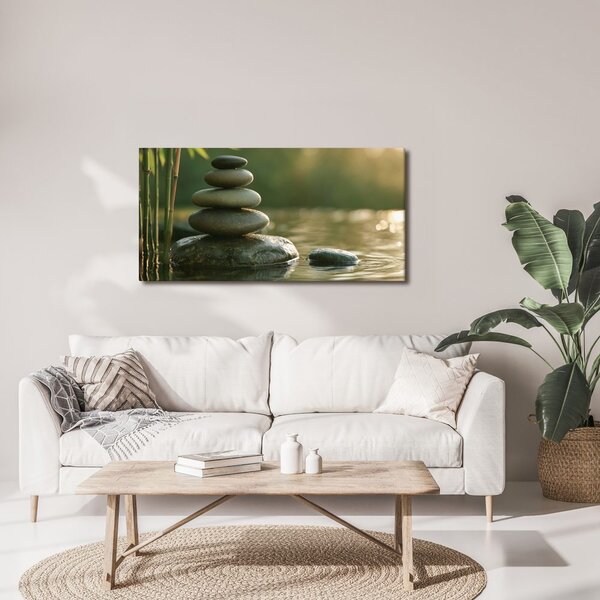 Quadro su tela – Equilibrio di pietre accanto al bambù