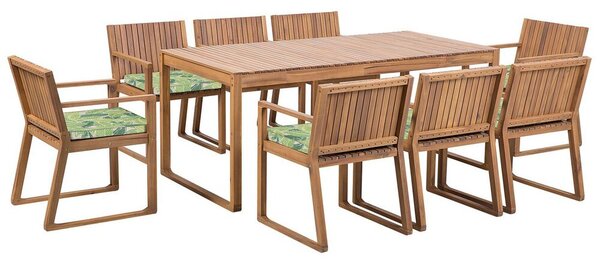 Set da pranzo da giardino 9 pezzi in legno di acacia chiaro 8 sedie con cuscini di seduta motivo foglia verde Beliani