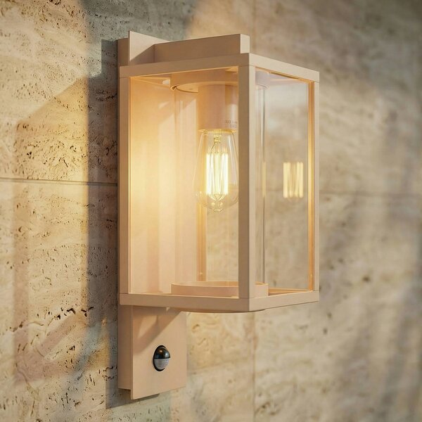 Lucande Applique da esterno Ferda, sensore, portalampada inferiore, beige Ferda Lucande, dimmerabile, Crema / Ambra, Alluminio, Moderno
