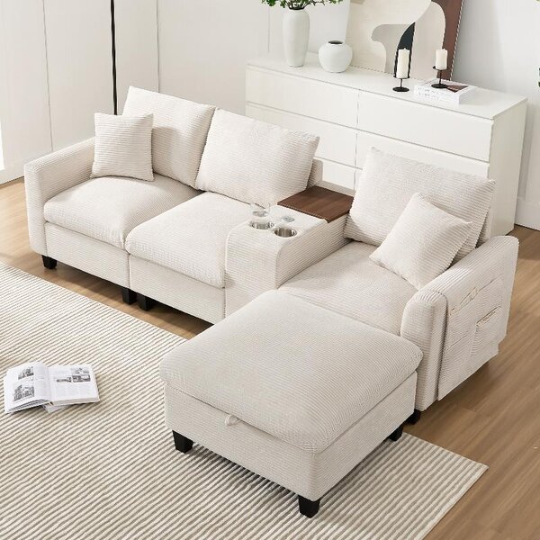 Divano ad angolo a forma di L, modello Cord, 4 posti, color beige, con poggiapiedi. Divano modulare con porta USB e portabicchieri, dotato di spazio contenitivo. Dimensioni: 229x149,5x83 cm
